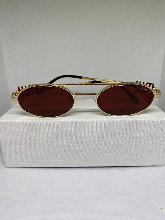 Miumiu dore rouge sang